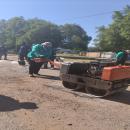 Mayor Dina Pitso patching potholes in Pache Street